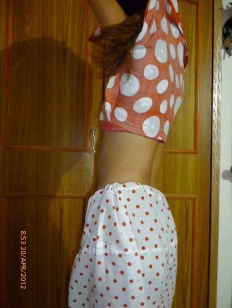 Topless Indian female covers up her nakedness with a well placed pillow