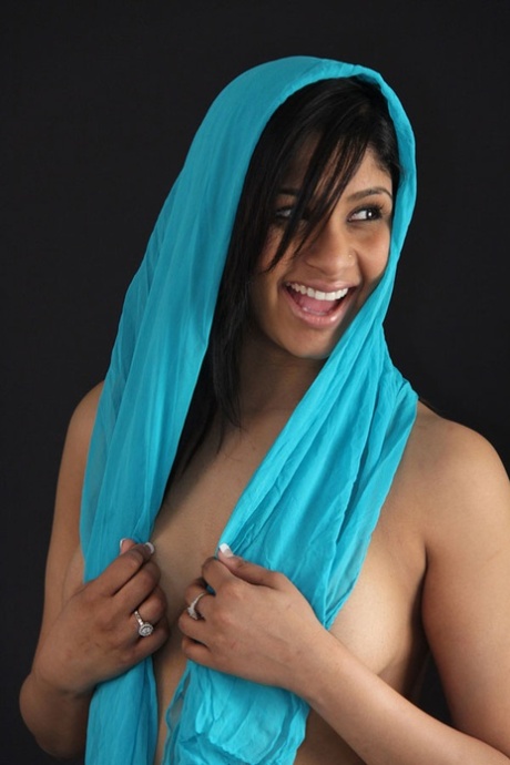 Indian babe shows her big natural tits in and out of see thru lingerie