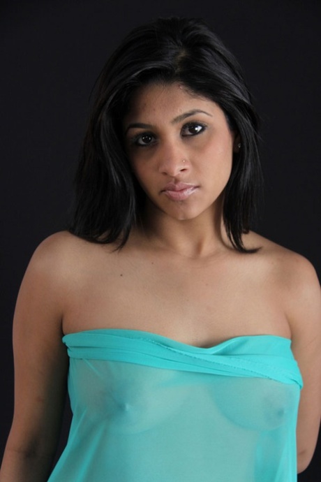 Indian babe shows her big natural tits in and out of see thru lingerie