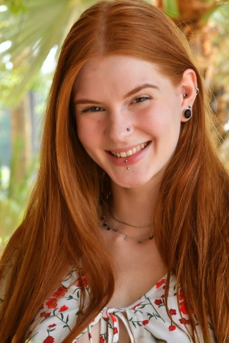 Natural redhead Jane slips cutoffs shorts aside to expose her cunt in public