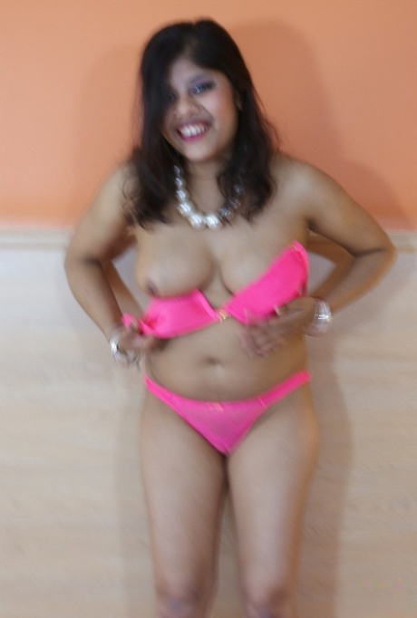 Overweight Indian female Rupali Bhabhi cups her boobs as she gets naked