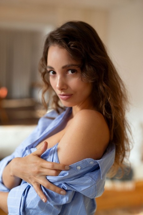 Beautiful British babe Calypso Muse removes her shirt and exposes sexy tits