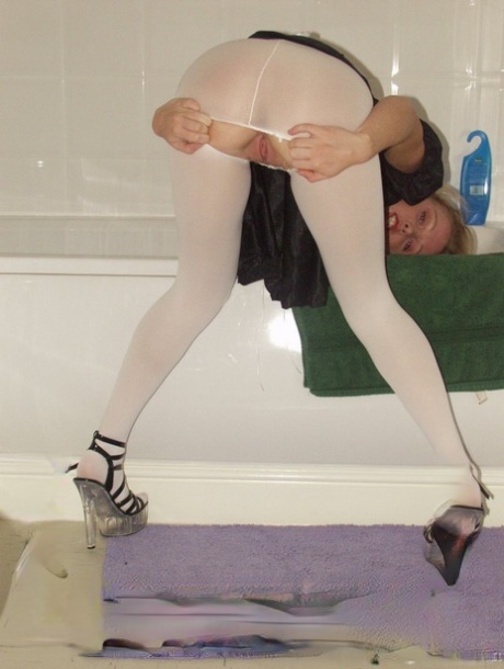 Little maid Louise rips her white pantyhose and poses in the bathroom