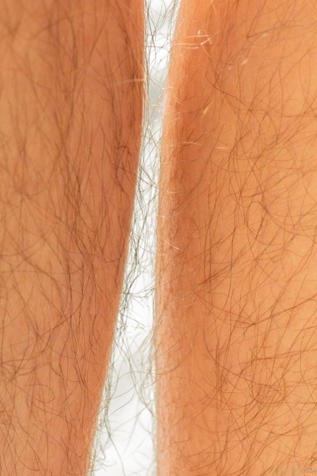 Chubby brunette Nikki Silver exposes her hairy armpits & crotch by the river