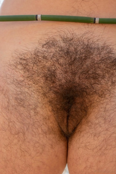 Chubby brunette Nikki Silver exposes her hairy armpits & crotch by the river