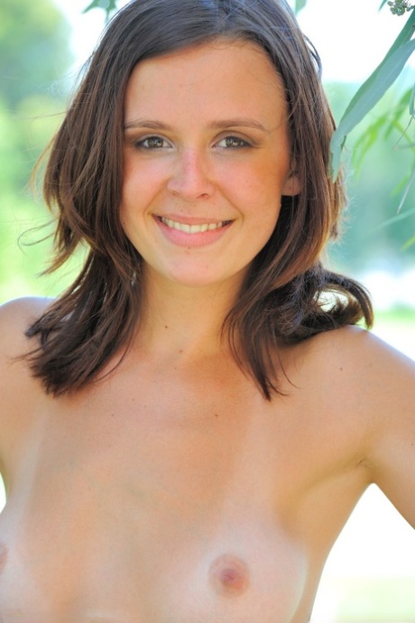 Brunette babe Cassidy strips naked in her garden & flashes her holes in public