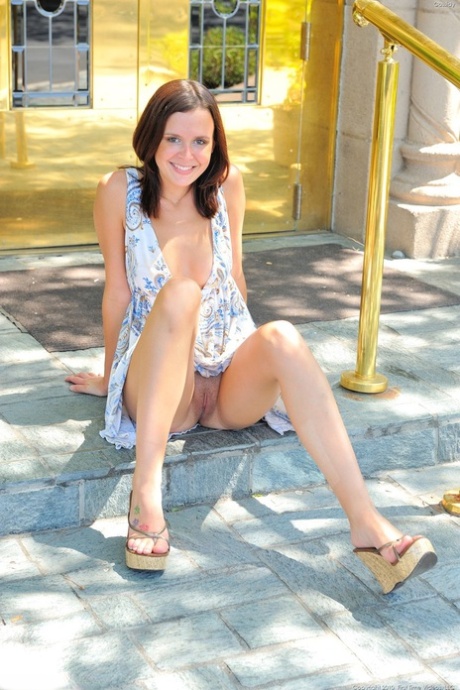 Brunette babe Cassidy strips naked in her garden & flashes her holes in public